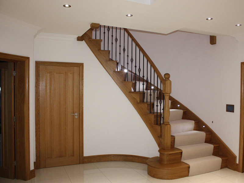 Custom curved oak skirting, oak doors and oak curved staircase